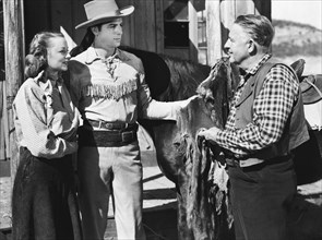 Jennifer Holt, Richard Arlen (center), on-set of the film, "Buffalo Bill Rides Again", Screen Guild