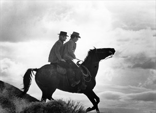 Two cowboys on horseback, on-set of the film, "Butch Cassidy And The Sundance Kid", 20th