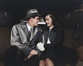 Dan Duryea, Ella Raines, on-set of the film, "White Tie And Tails", Universal Pictures, 1946