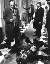 Arthur Kennedy (left with handgun), on-set of the Spanish-Italian film, "Don't Open The Window",