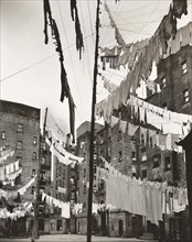 Courtyard of tenement buildings filled with lines of laundry, Yorkville, New York City, New York,