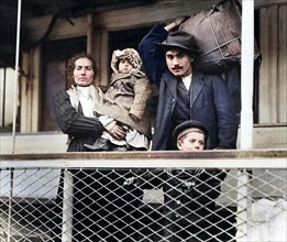 Italian immigrant family on ferry, leaving Ellis Island, New York City, New York, USA, Lewis Wickes