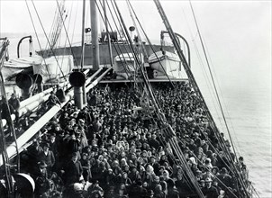 Crowd of men and women immigrants on deck of S.S. Patricia, Edwin Levick, December 1906