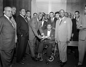 Former Brooklyn Dodgers baseball players Jackie Robinson and Roy Campanella (in wheelchair) with