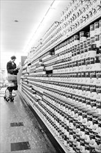 Woman shopping in supermarket, Thomas J. O'Halloran, U.S. News & World Report Magazine Photograph