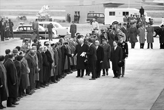 U.S. President Dwight Eisenhower shaking hands with line of men, Turkish president Celal Bayar