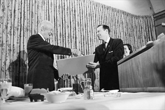 U.S. President Dwight D. Eisenhower shaking hands with member of Young Republicans at event,