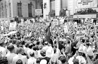 U.S. Vice President Richard M. Nixon and his family surrounded by crowds of supporters as they