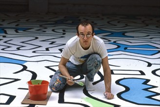 American artist Keith Haring painting backdrop for Palladium Nightclub, New York City, New York,