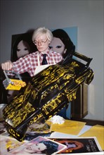 American pop artist Andy Warhol, half-length portrait painting miniature model car, Bernard