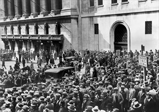 Crowd of people gather outside the New York Stock Exchange following the stock market crash, New