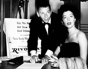 Frank Sinatra and Ava Gardner signing a pledge as good citizens, Herman Hiller, New York