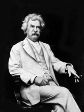 American Writer and Humorist Samuel Clemens, better known as Mark Twain, three-quarter length