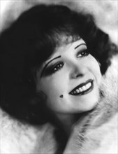 Clara Bow, American actress, head and shoulders publicity portrait with heart-shaped beauty mark on