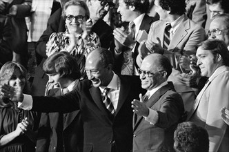 Egyptian President Anwar Sadat and Israeli Prime Minister Menachem Begin acknowledge applause