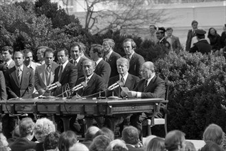 Egyptian President Anwar Sadat, U.S. President Jimmy Carter, Israeli Prime Minister Menachem Begin,