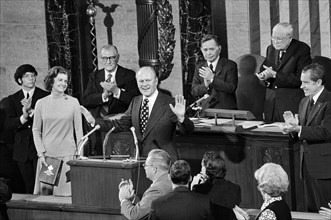 Betty Ford holding bible at Joint Session of Congress, in House Chamber, for swearing in of her