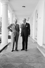 U.S. President Dwight Eisenhower standing with British Prime Minister Harold Macmillan outside