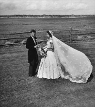 U.S. Senator John Kennedy and Jacqueline Bouvier Kennedy, in wedding attire, Newport, Rhode Island,