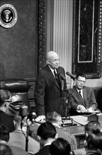 U.S. President Dwight Eisenhower speaking in front of microphones at press conference, Washington,