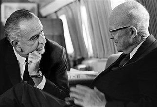 U.S. President Lyndon Johnson meeting with former U.S. President Dwight Eisenhower aboard Air Force