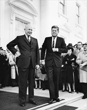 U.S. President Dwight Eisenhower and U.S. President-elect John Kennedy stand before reporters