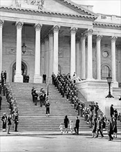 U.S. Honor Guard pallbearers carrying flag-draped casket of late U.S. President John Kennedy up