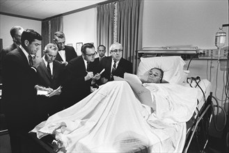 U.S. President Lyndon Johnson meeting with the press following throat polyp removal surgery,