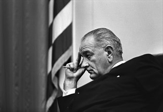 U.S. President Lyndon Johnson listening during cabinet meeting, Cabinet Room, White House,