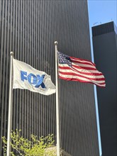 Fox News and American flags flying outside News Corp Building, Avenue of the Americas, New York