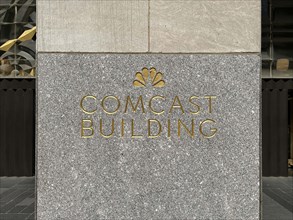 Comcast Building with NBC peacock logo etched in granite on building exterior, New York City, New