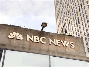 NBC News and peacock logo, building exterior, low angle view, Rockefeller Center, New York City,