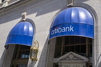 Citibank retail banking office, building exterior with blue awning above windows, New York City,