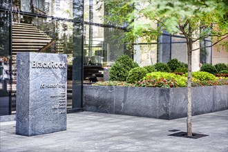 BlackRock, Inc., American international investment company, company sign and flower garden outside