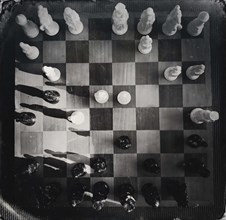 High angle view of chess board and chess pieces