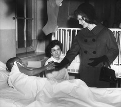 U.S. First Lady Jacqueline Kennedy visiting with patients at Children’s Hospital, Washington D.C.,