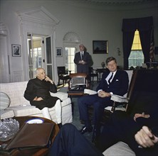 U.S. President John Kennedy (sitting in rocking chair) meeting with Prime Minister of India