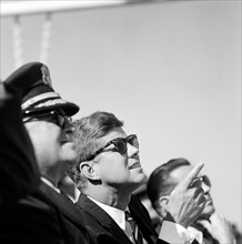 U.S. President John Kennedy sitting between General George H. Decker, Chief of Staff of U.S. Army