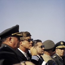 U.S. President John Kennedy sitting between General George H. Decker, Chief of Staff of U.S Army