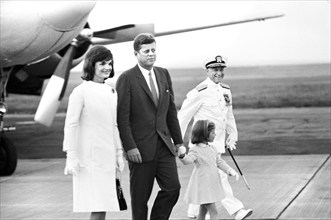 U.S. President John F. Kennedy greeting U.S. First Lady Jacqueline Kennedy and Caroline Kennedy