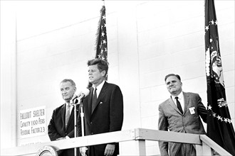 U.S. President John F. Kennedy delivering remarks following tour, with U.S. Vice President Lyndon