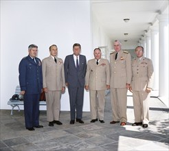 U.S. President John F. Kennedy standing with the Joint Chiefs of Staff, left to right: General