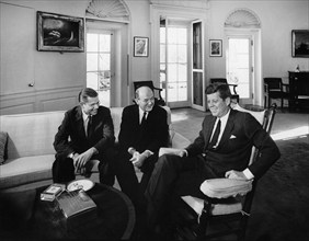 U.S. President John F. Kennedy (in rocking chair) meeting with U.S. Secretary of Defense, Robert S.