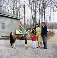 U.S. President John F. Kennedy and U.S. First Lady Jacqueline Kennedy stand with their children,