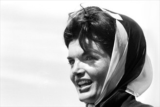 Close-up portrait of U.S. First Lady Jacqueline Kennedy watching first race of America's Cup from