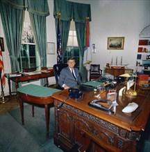 U.S. President John F. Kennedy sitting at his desk (HMS Resolute Desk), Oval Office, White House,