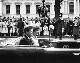 U.S. President John F. Kennedy and Eunice Kennedy Shriver travel in Presidential convertible