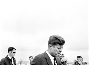 U.S. President John F. Kennedy smoking a cigar, Hyannis Port, Massachusetts, USA, Cecil Stoughton,