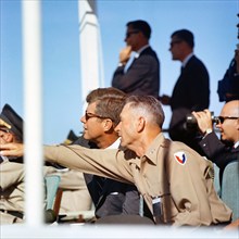 U.S. President John F. Kennedy (wearing sunglasses) and Commanding General J. Frederick Thorlin