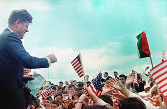 U.S. President John F. Kennedy (left) greeting crowd of Irish school children after arriving at